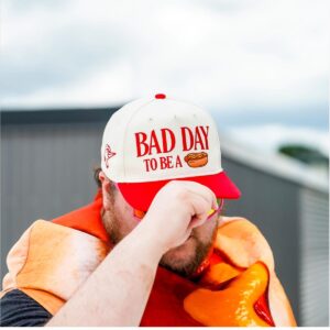 zkDTQ3so 2026 Fayetteville Woodpeckers Bad Day To Be A Hot Dog Hat 11 2 1